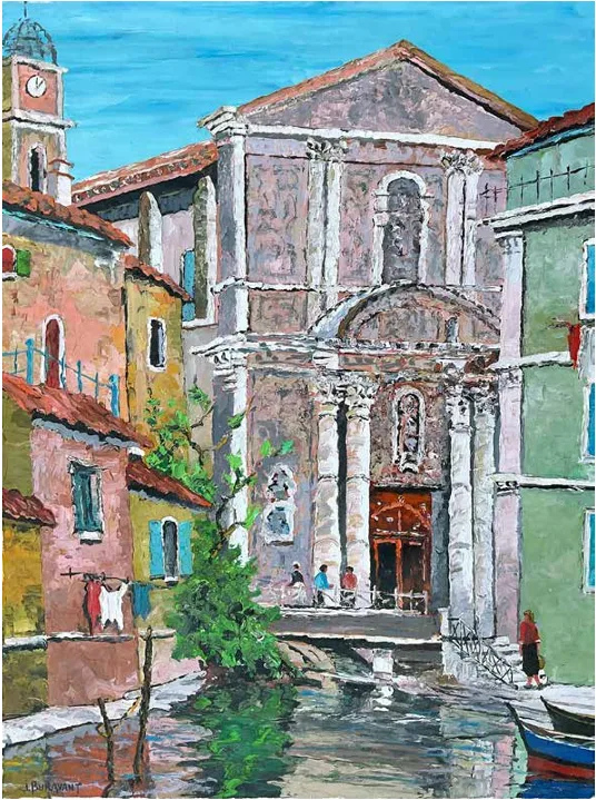 Façade d'une église provençale avec son clocher, ruelle bordée de maisons colorées et canal au premier plan.